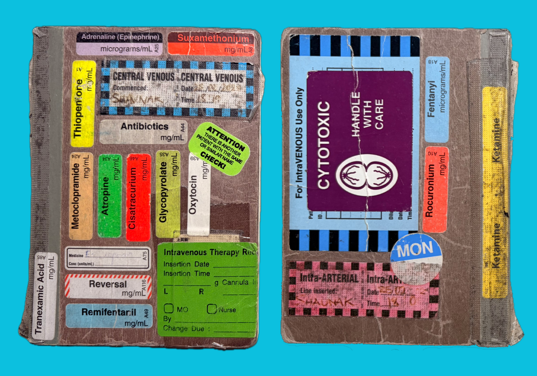 The front and back of a Muji lie-flat notebook, decorated with numerous hospital stickers.